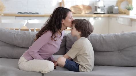 mom and son sexy video|Mother Son Sofa Kissing stock videos and footage.